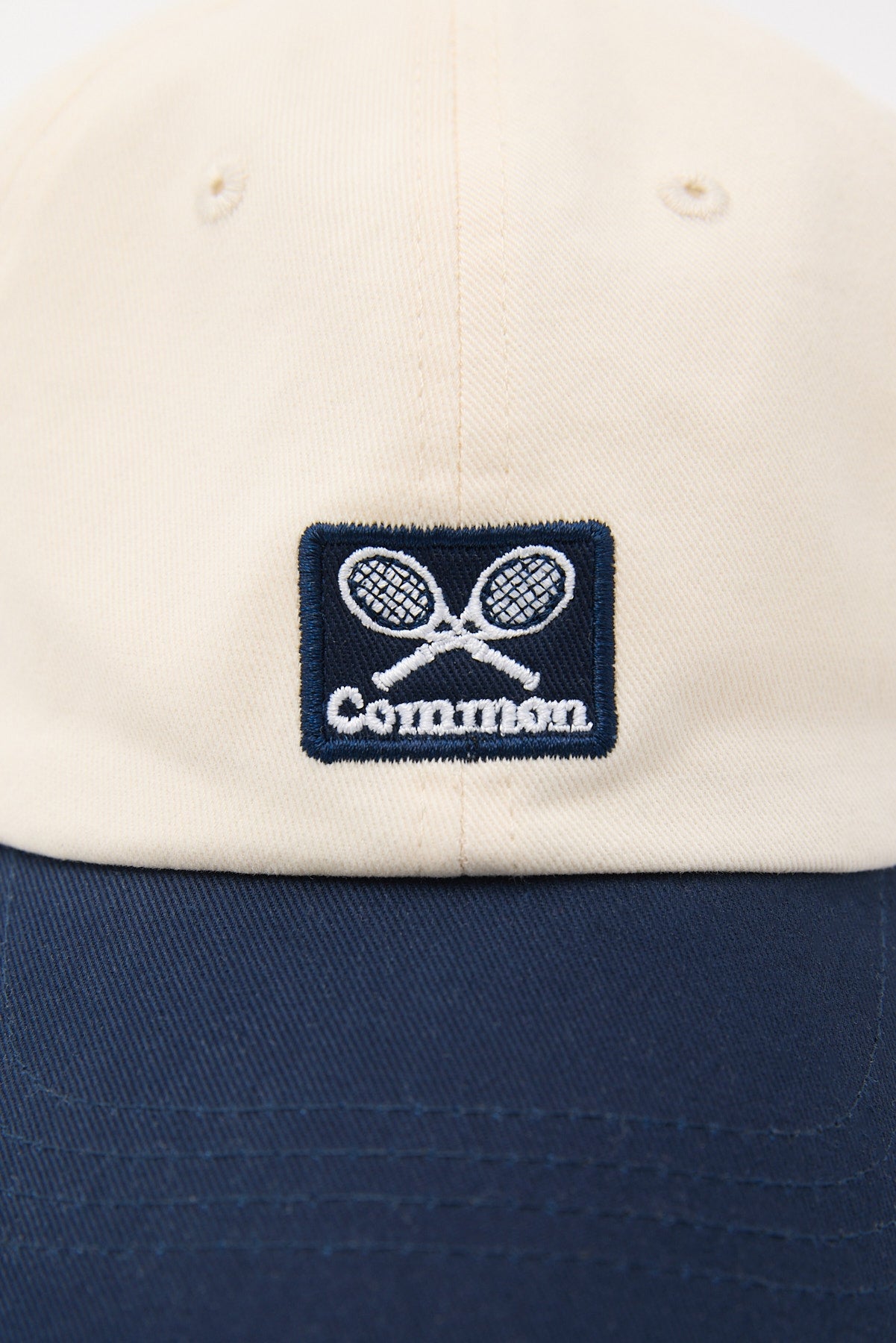 Common Need Racket Dad Cap Off White/Navy